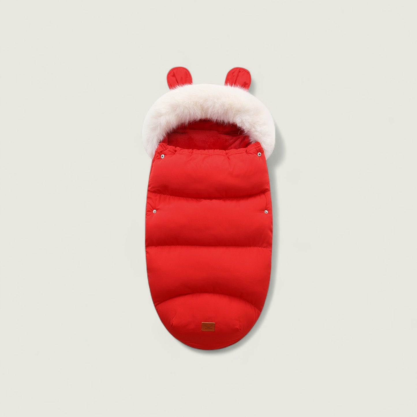 Red baby stroller footmuff with white fur trim on a light gray background