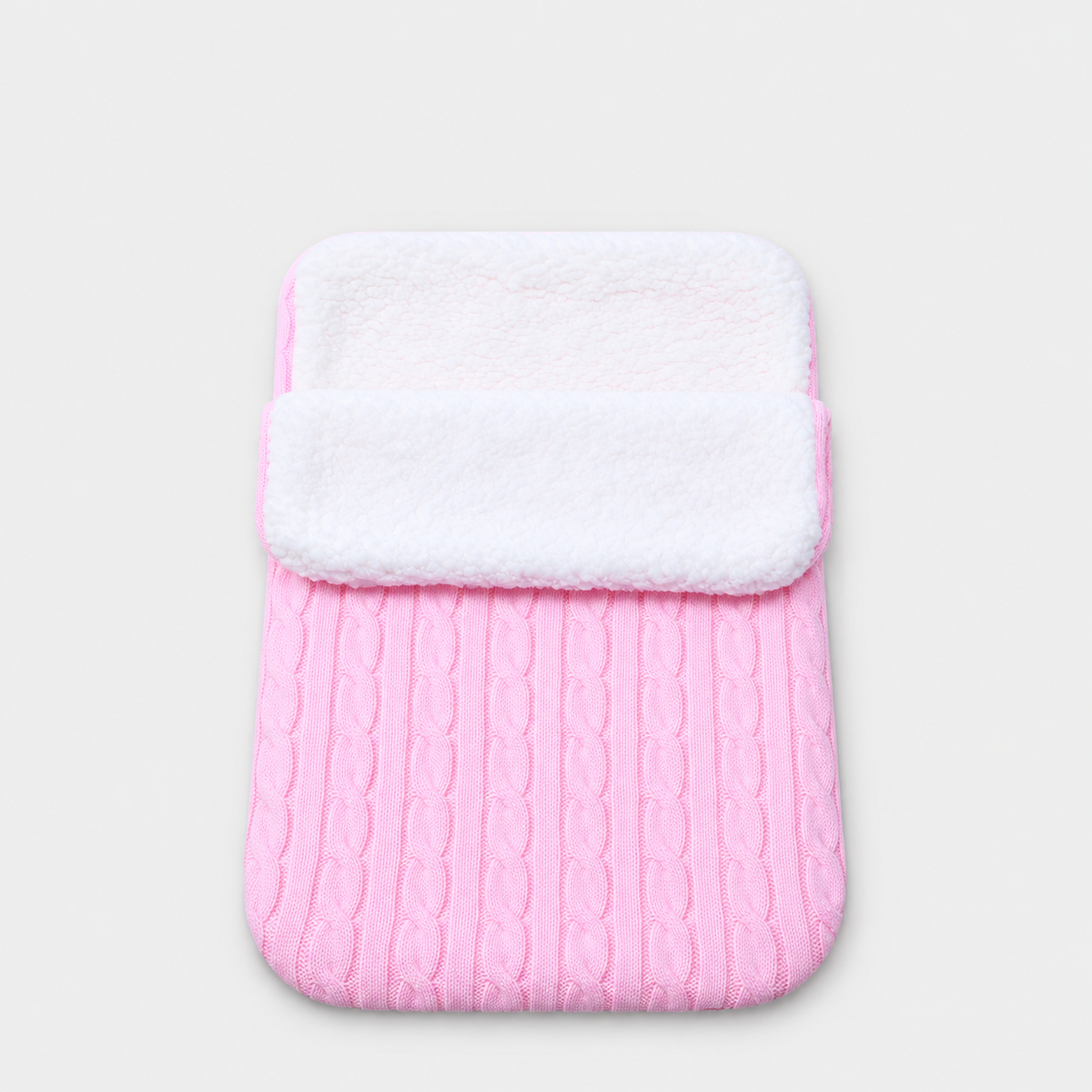 Pink cable-knit envelope wrap with white plush lining