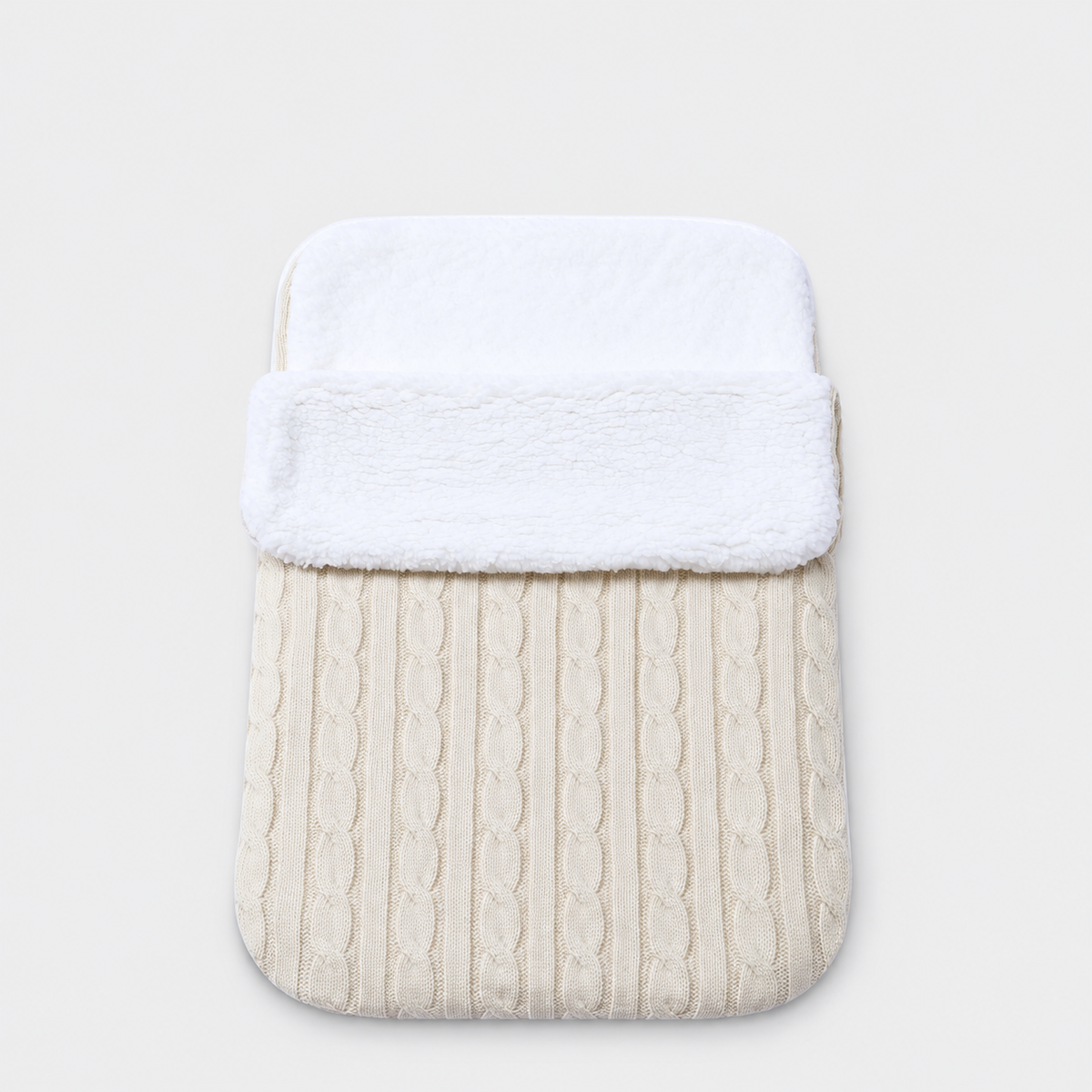 Cream cable-knit envelope wrap with white plush lining