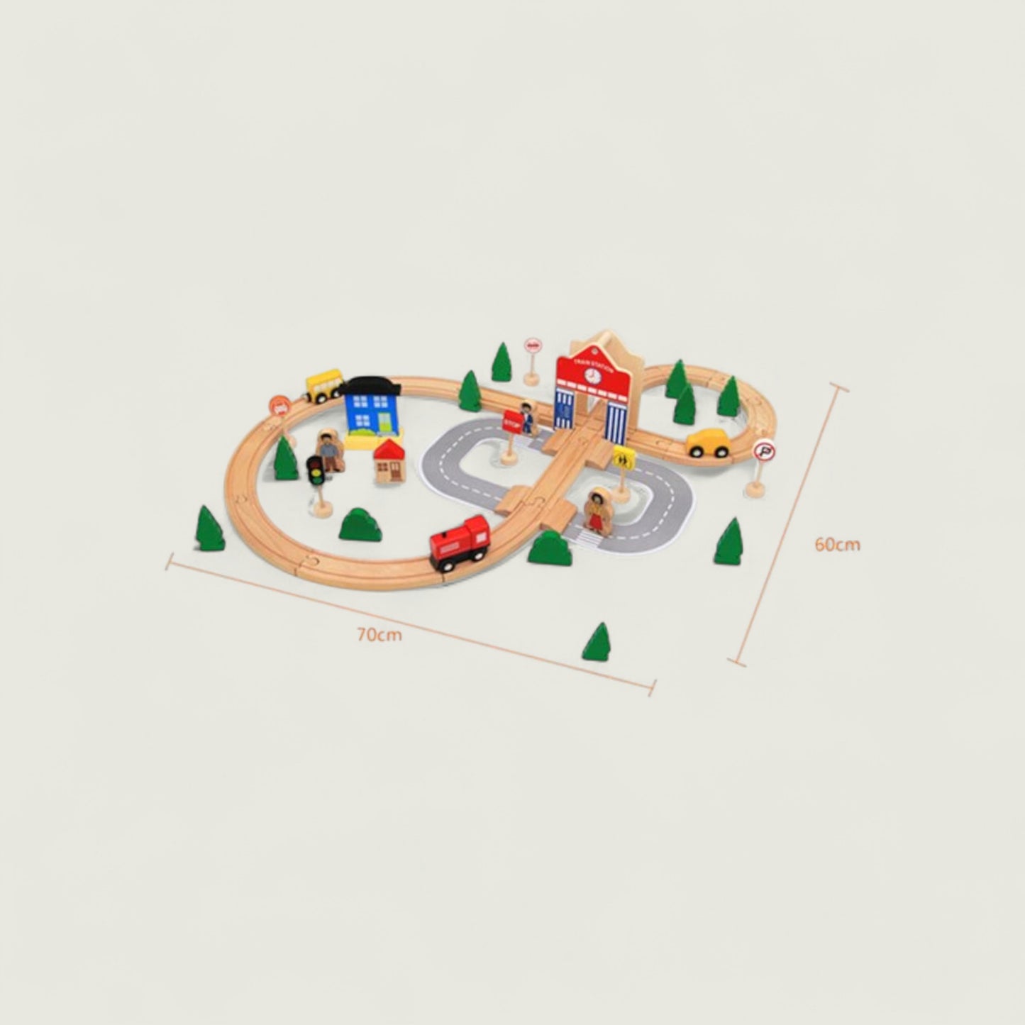 Wooden toy train set with tracks, cars, and buildings on a beige background