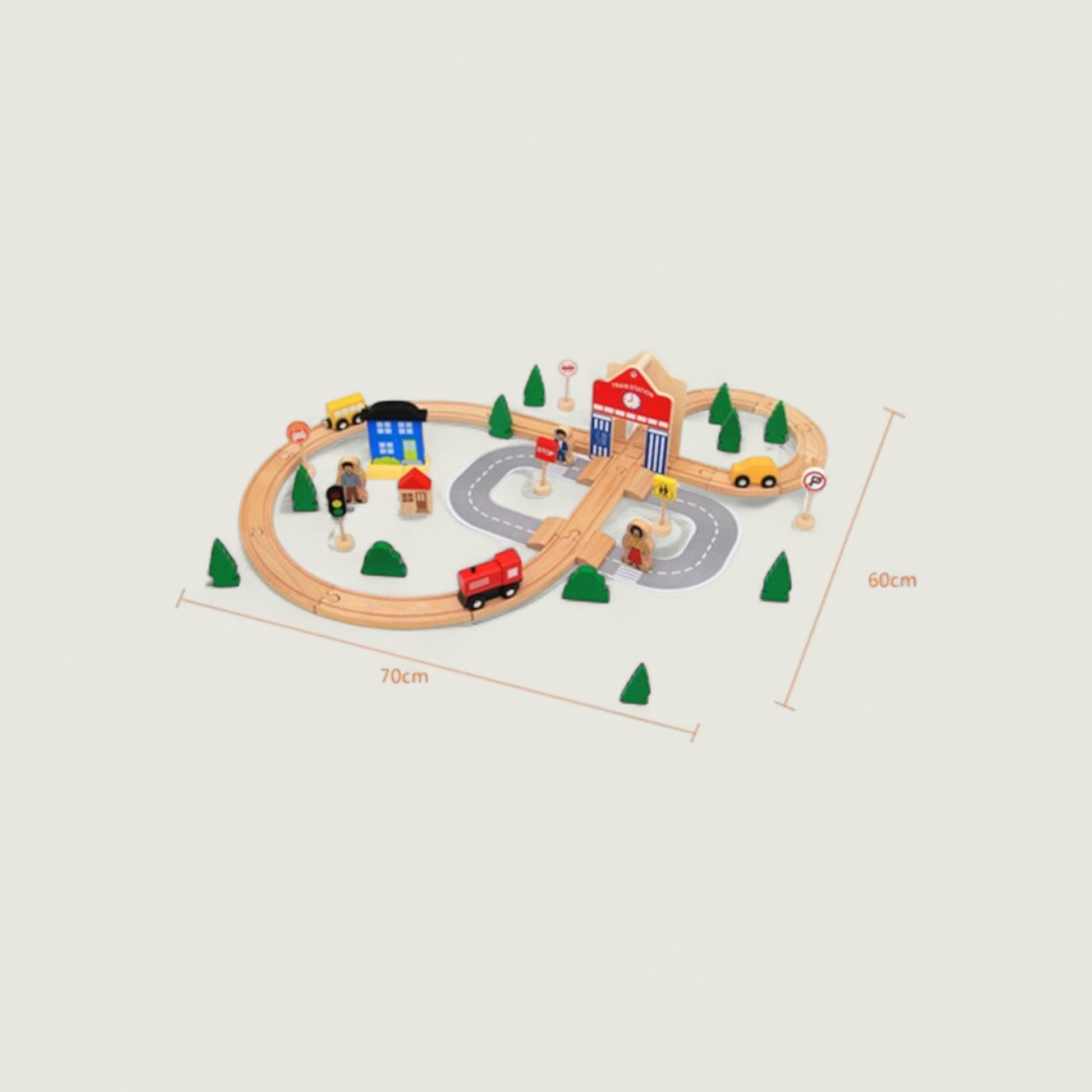 Wooden toy train set with tracks, cars, and buildings on a beige background