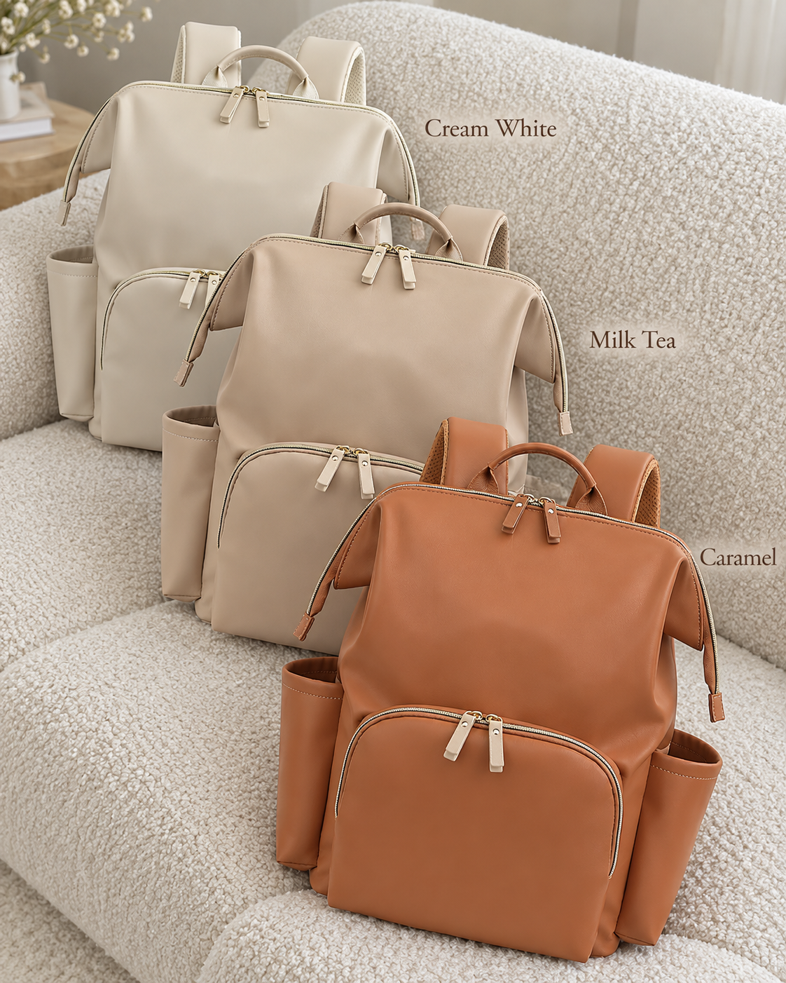 Cream White, Milk Tea and Caramel backpacks together on a boucle sofa