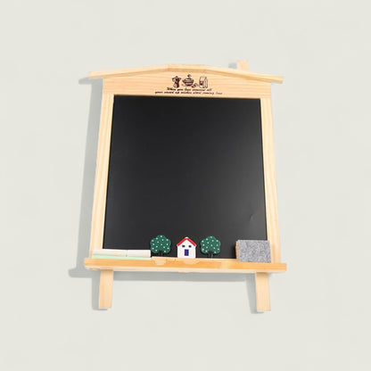 Blackboard with wooden frame and small decorative items on a light gray background