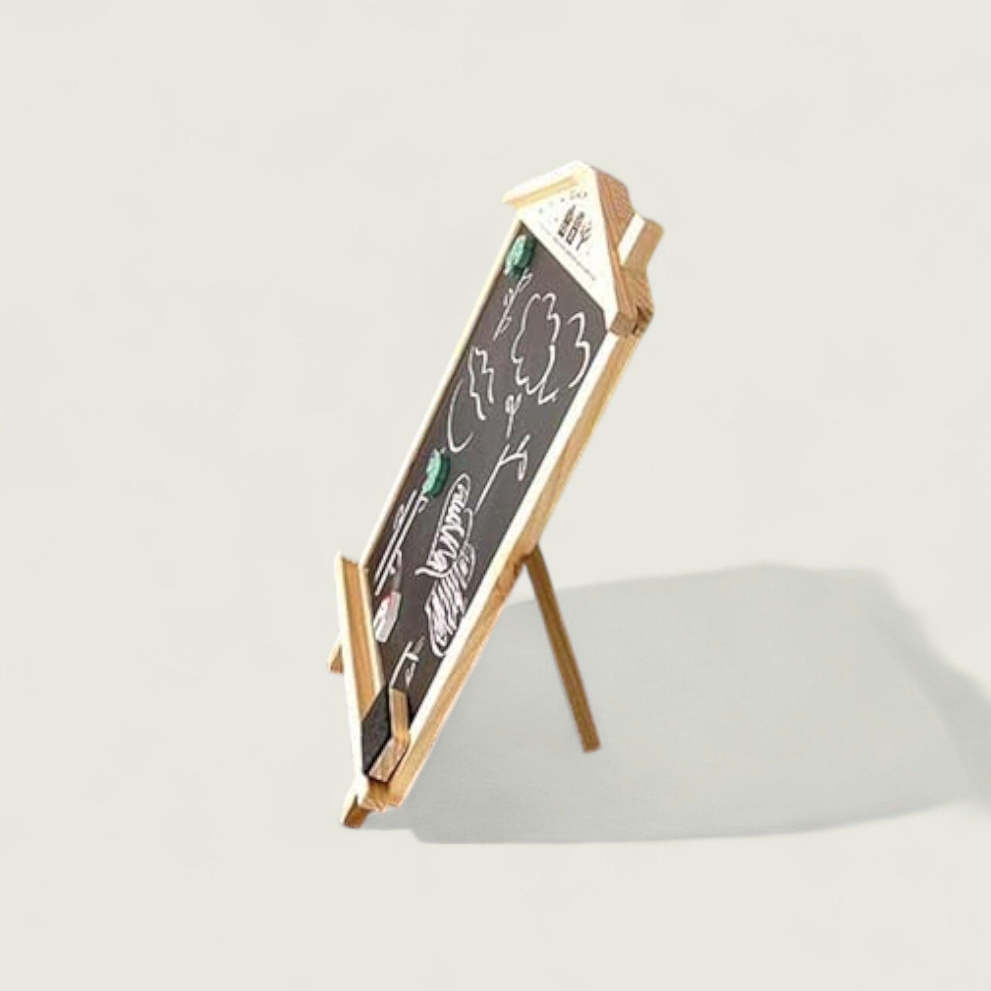 Small blackboard with wooden stand on a light gray background