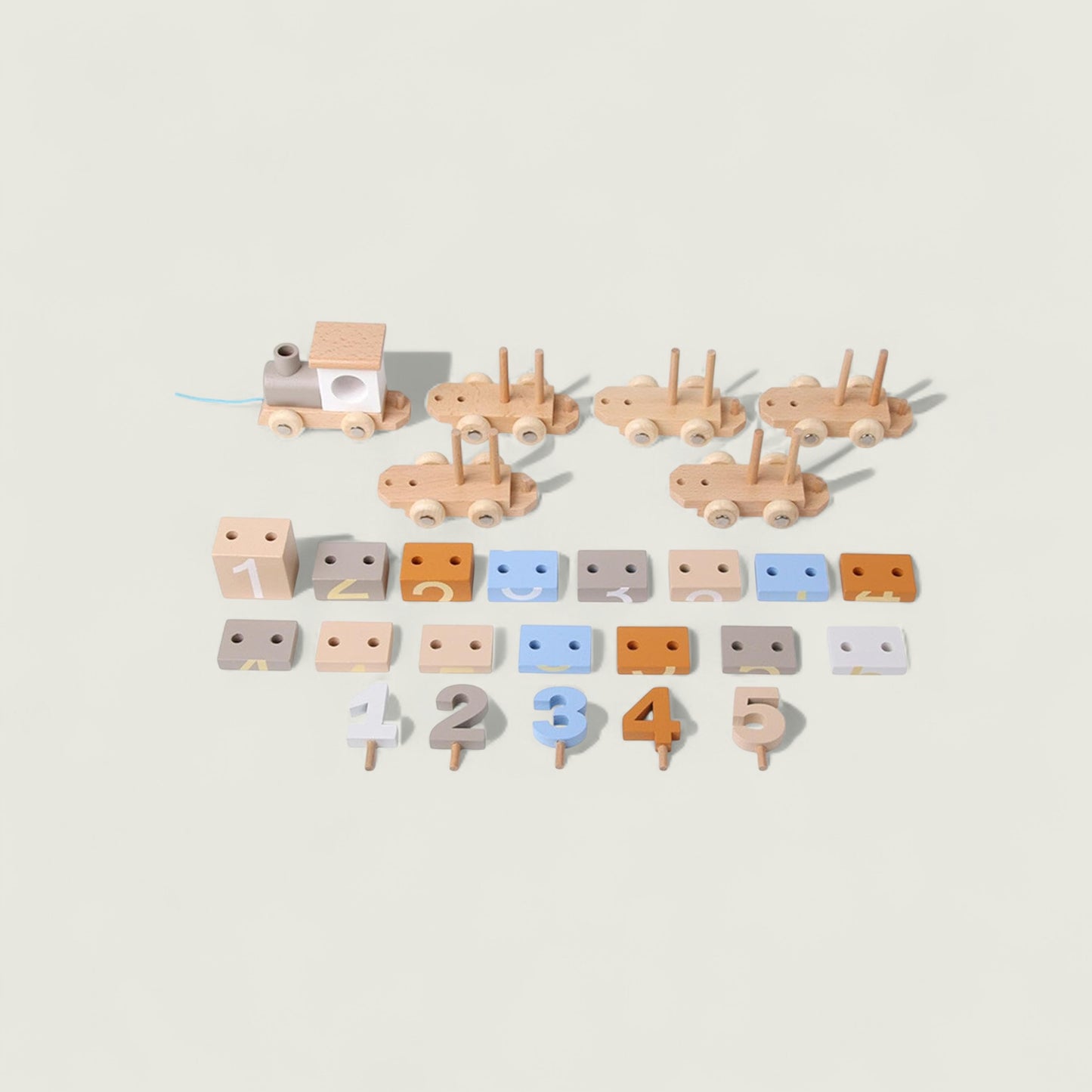 Set of wooden toys including cars and numbers on a beige background