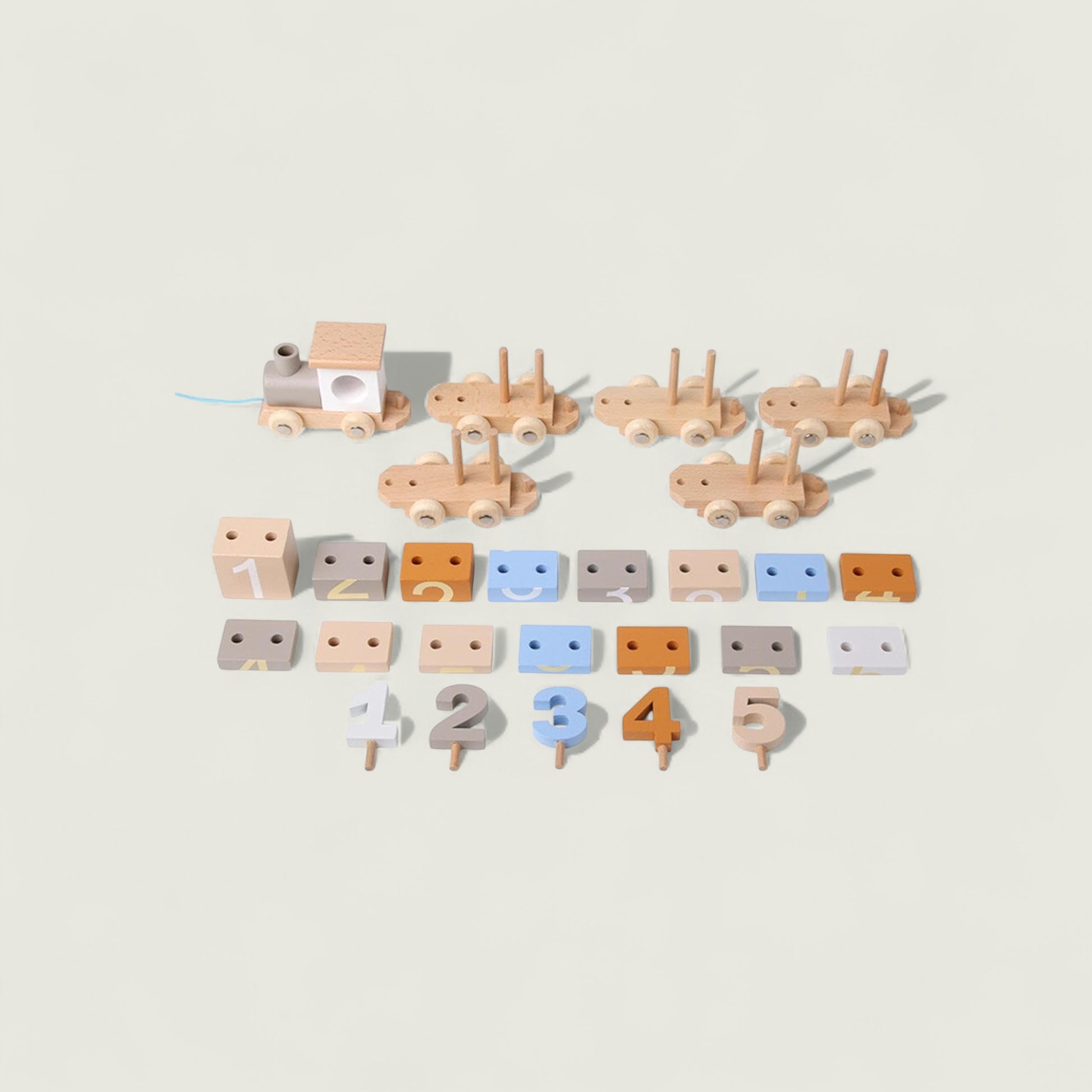 Set of wooden toys including cars and numbers on a beige background