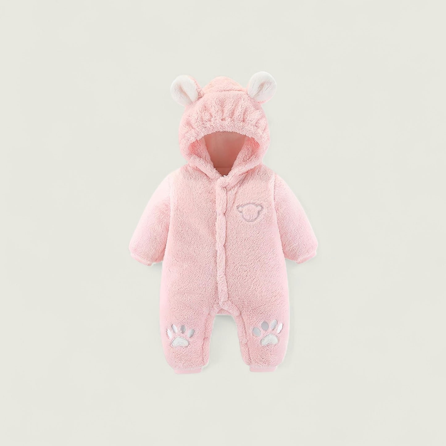 Pink baby snowsuit with hood and paw prints on a light gray background