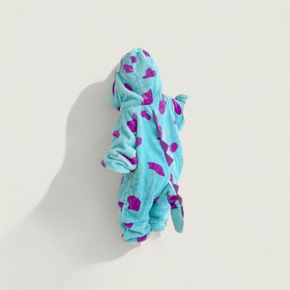 Blue hooded towel with purple hearts on a light gray background