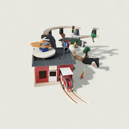 Toy set with a red building, train, and various figures on a light gray background