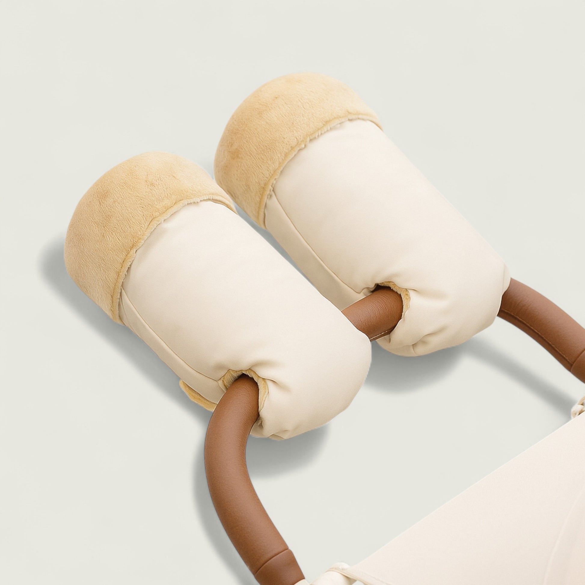 Pair of beige and brown baby bouncer attachments on a light gray background