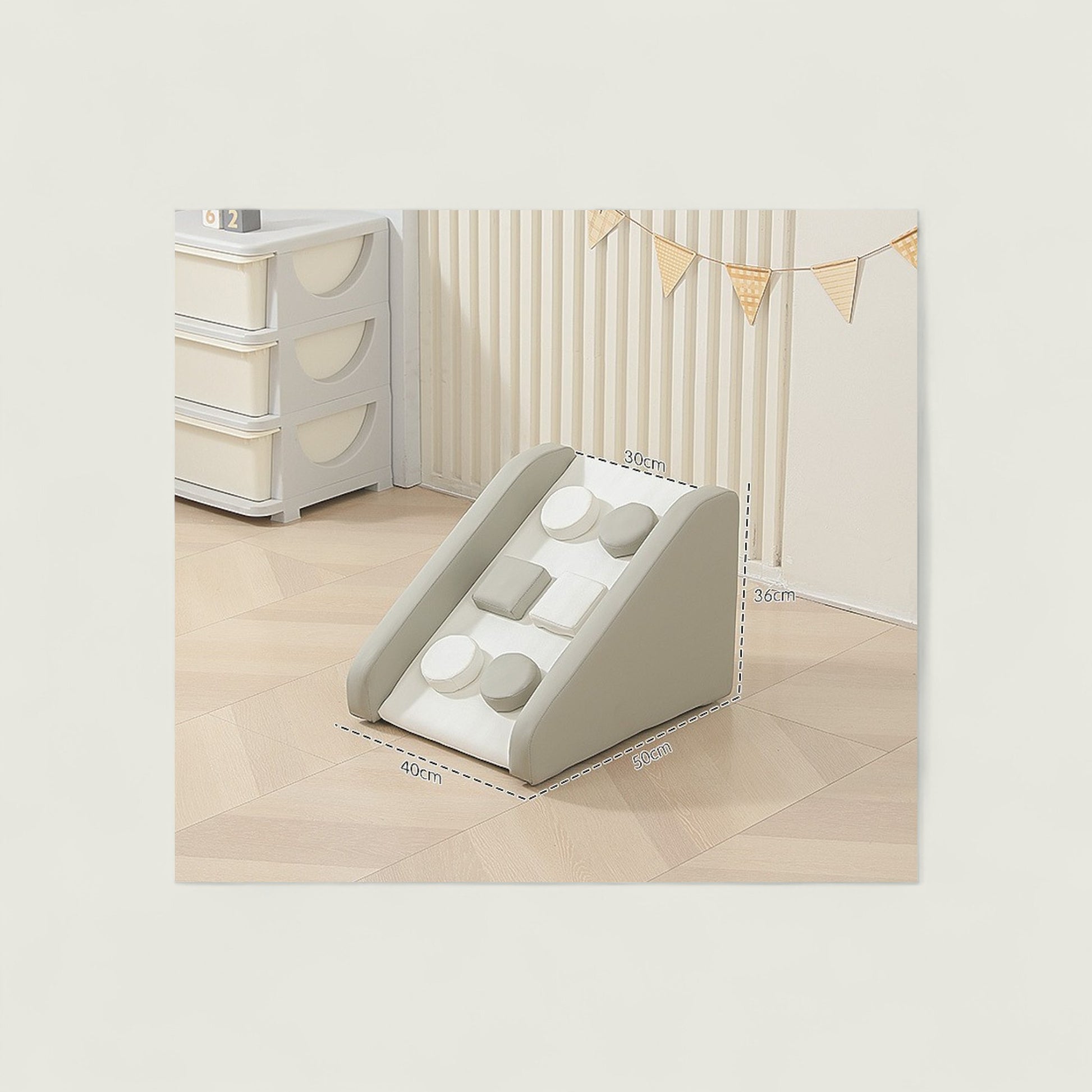 Children's play area with a geometric shape sorting toy and storage unit.