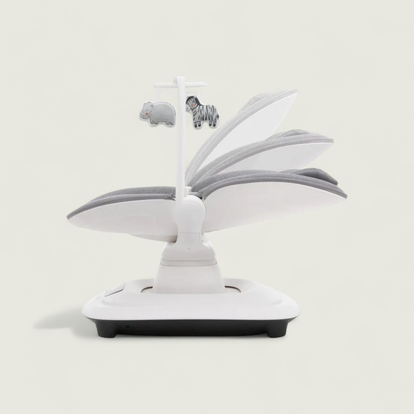 White baby crib mobile with animal figures on a light gray background