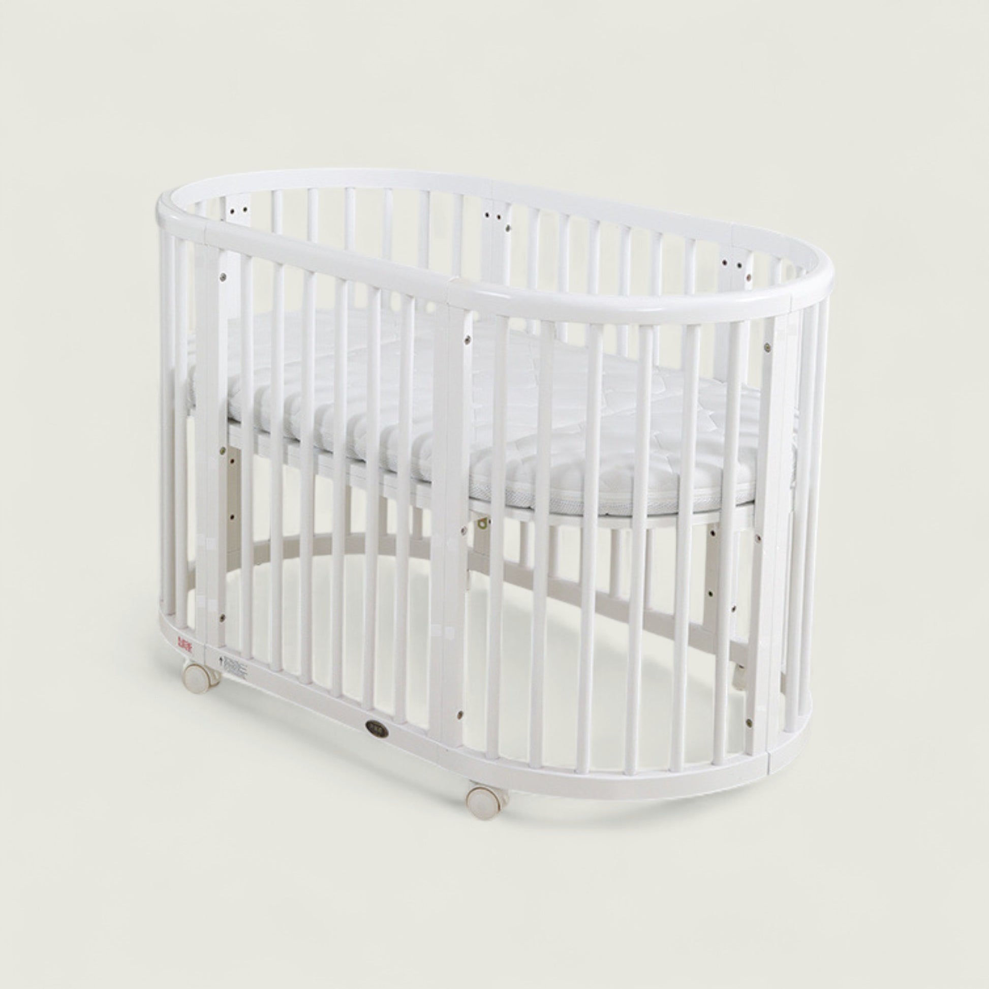 White crib on a light gray background