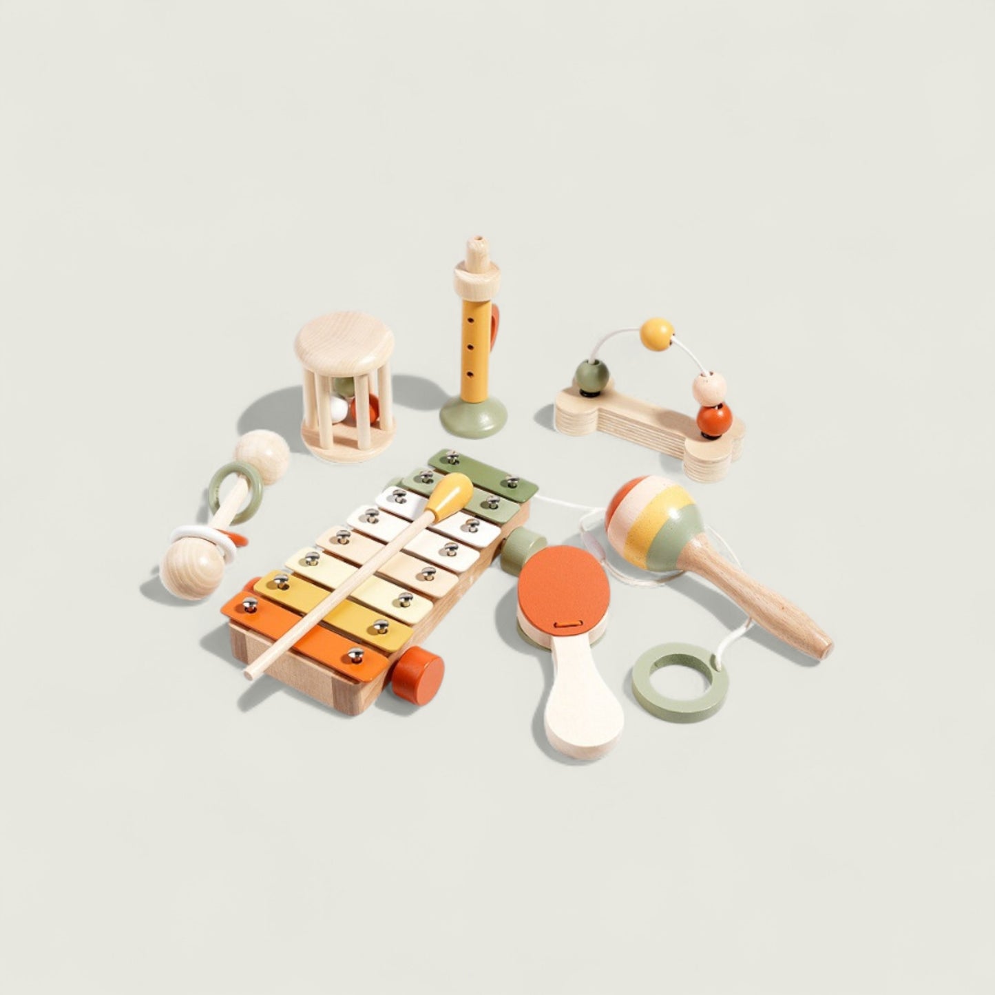 Set of colorful wooden toys on a light gray background
