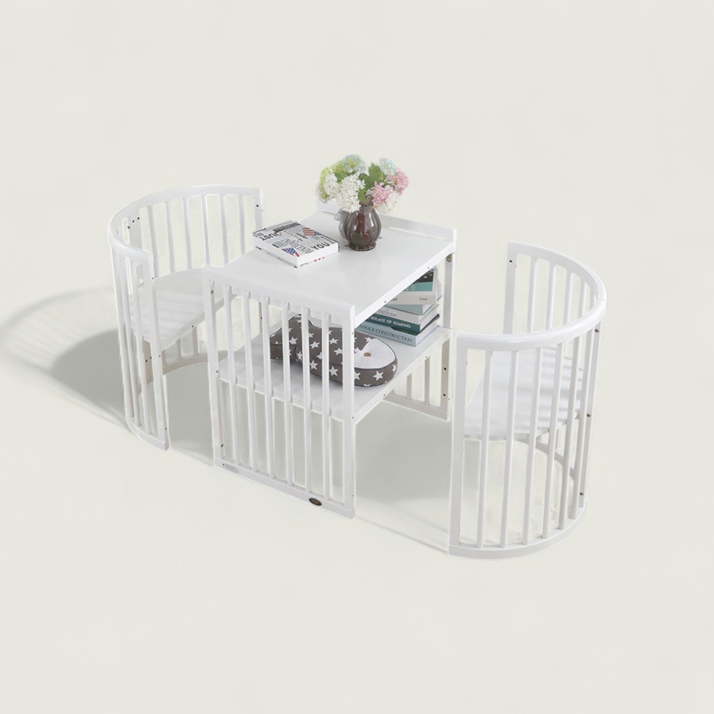 White pet playpen with a small table inside on a light gray background
