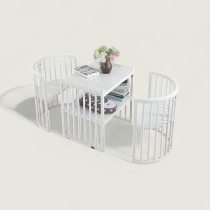 White pet playpen with a small table inside on a light gray background