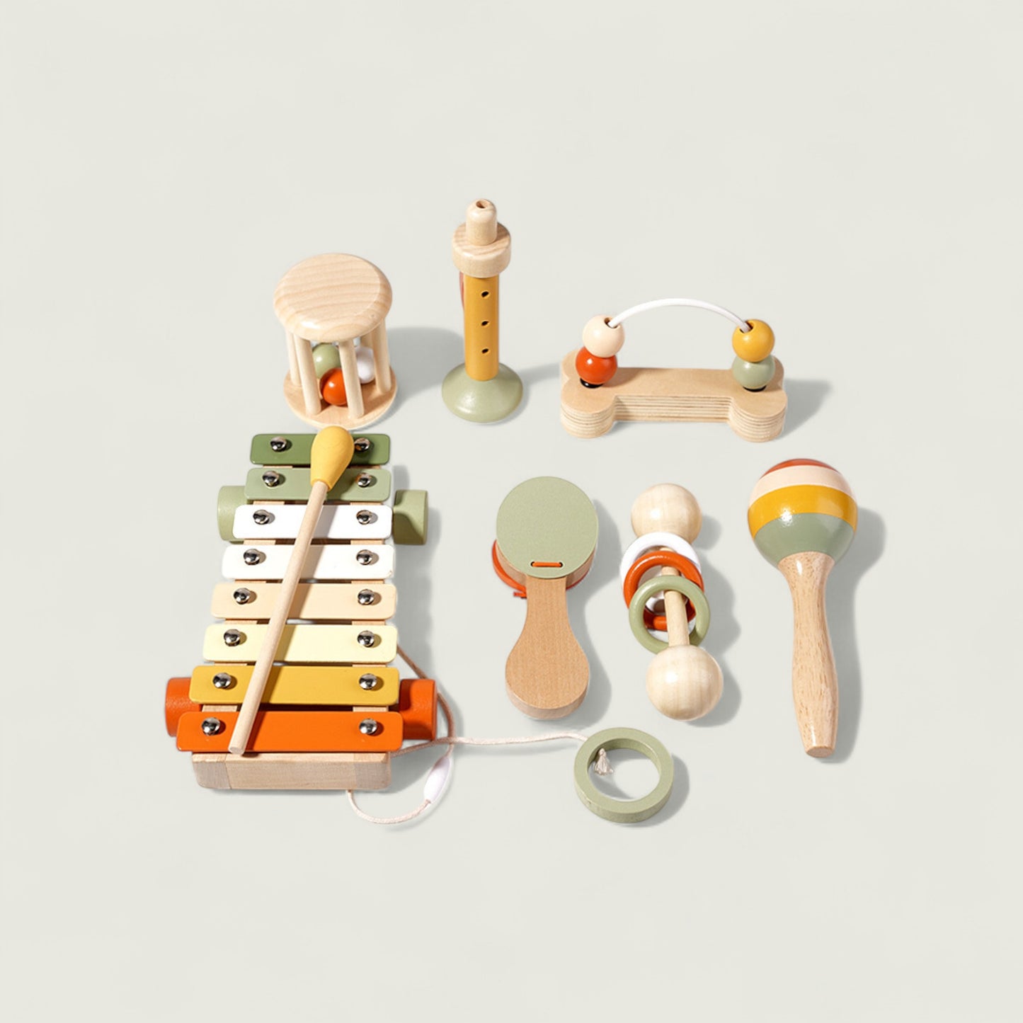 Set of colorful wooden toys on a light gray background