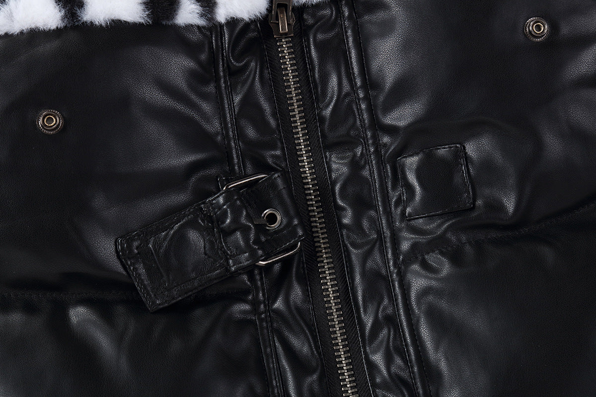 Close-up of a black leather jacket with a zipper and fur trim.