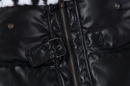 Close-up of a black leather jacket with a zipper and fur trim.