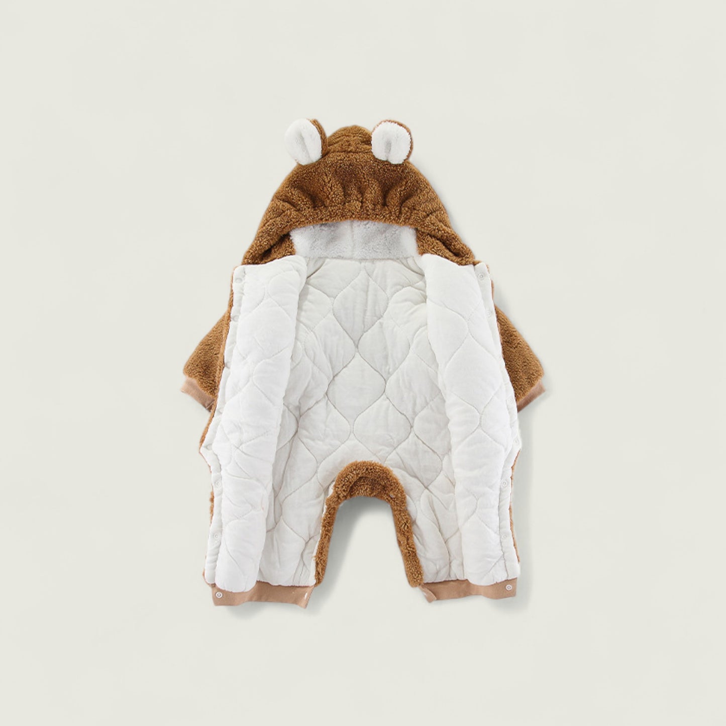 Children's animal-themed outfit with a hood on a beige background