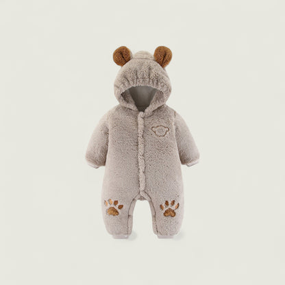 Children's gray onesie with bear ears and paw prints on a light gray background