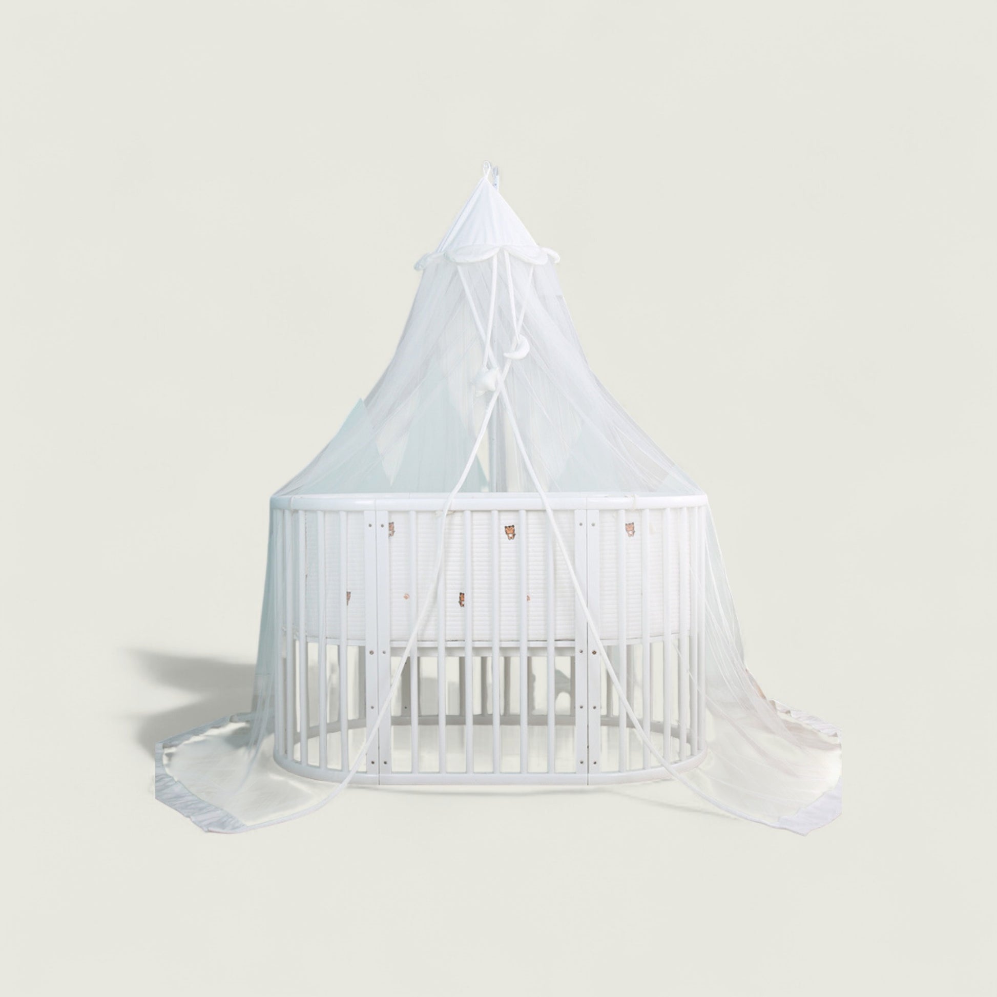 White crib with canopy on a light gray background