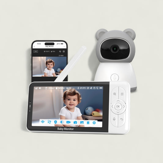 Baby monitor system with a screen displaying a child, a remote control, and a smartphone showing the same view.