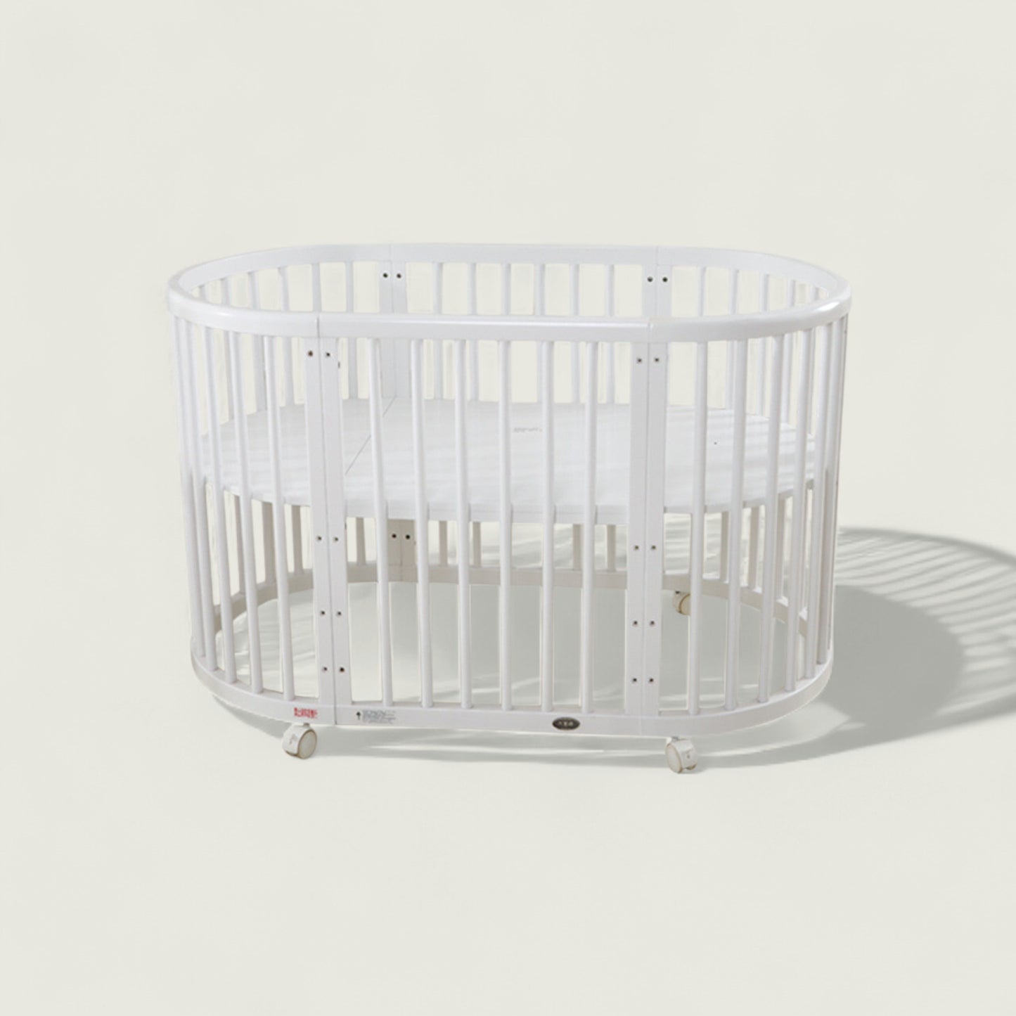 White crib on a light gray background