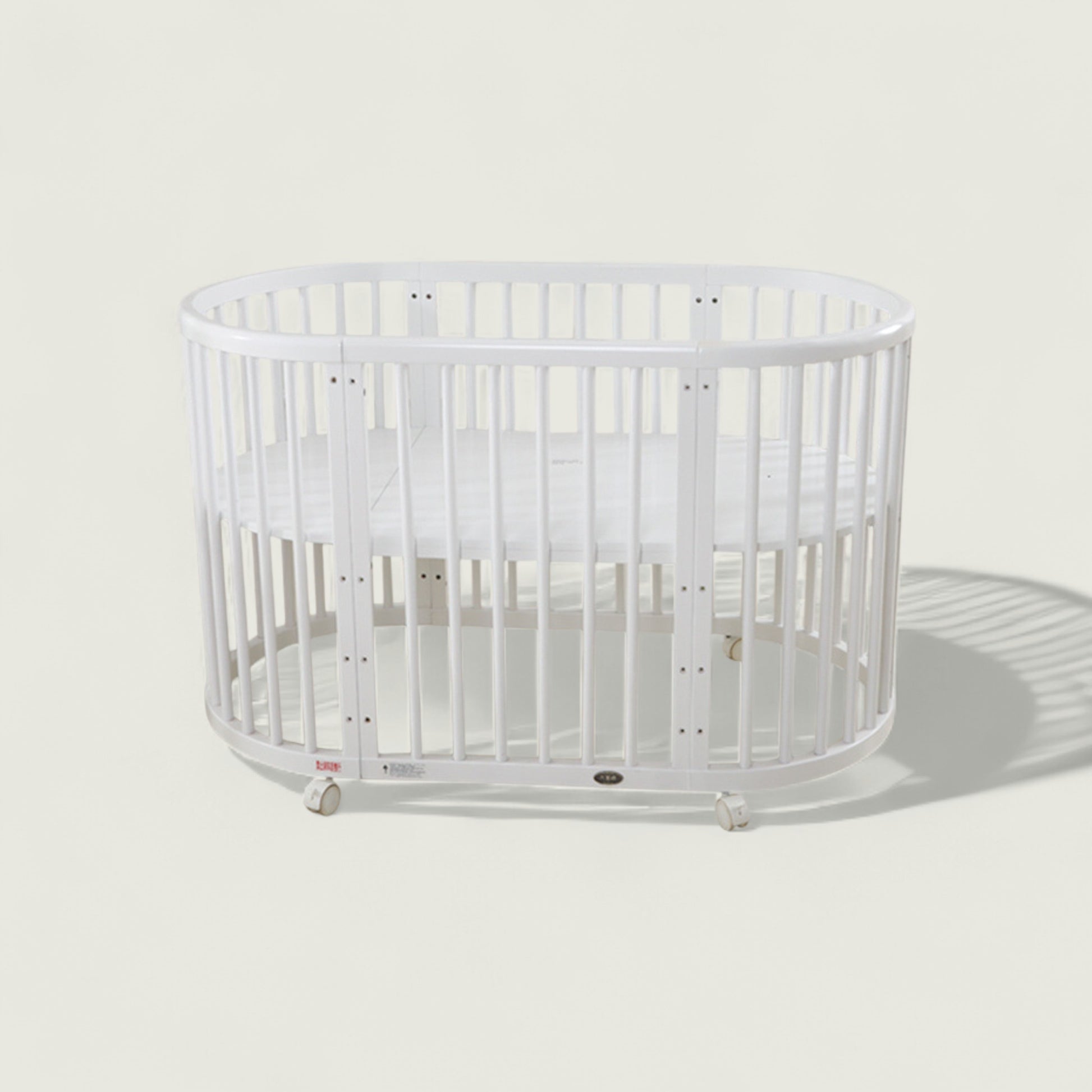 White crib on a light gray background