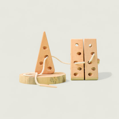 Wooden toy with a rope on a light gray background