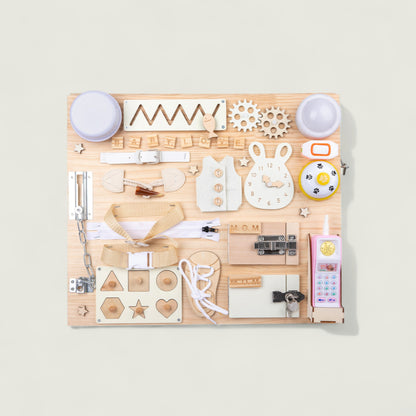 Wooden craft set with various stamps and tools on a light background