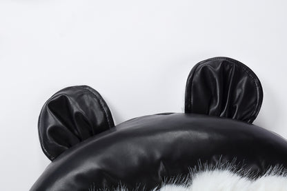 Black cushion with cat ears on a white background