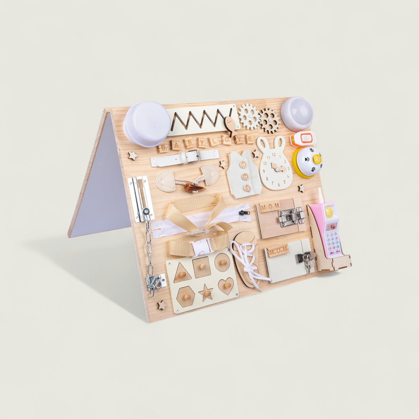Wooden educational toy with various shapes and letters on a light beige background