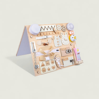 Wooden educational toy with various shapes and letters on a light beige background