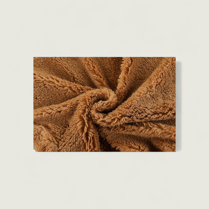 Brown textured blanket on a light beige background