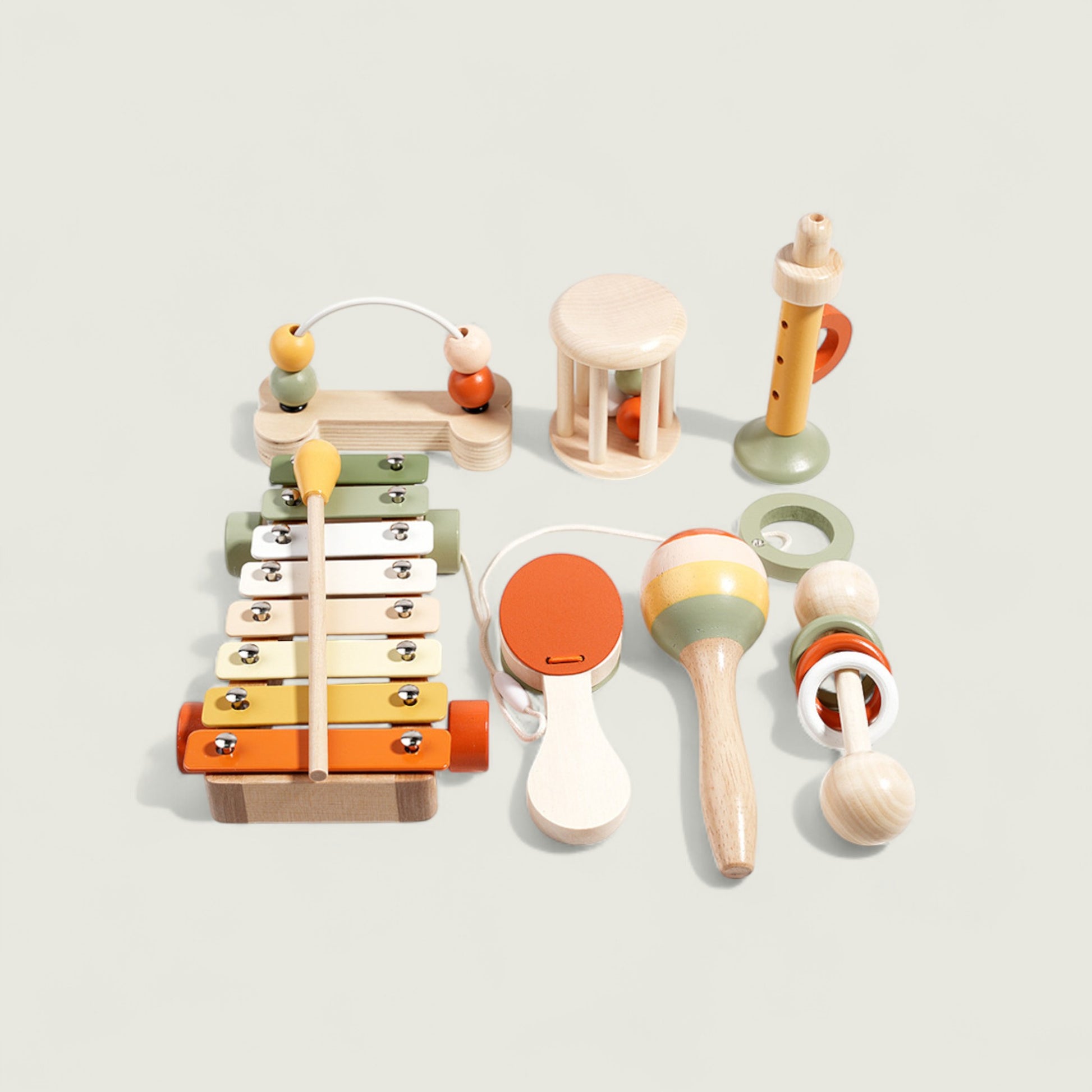 Set of colorful wooden toys on a light gray background