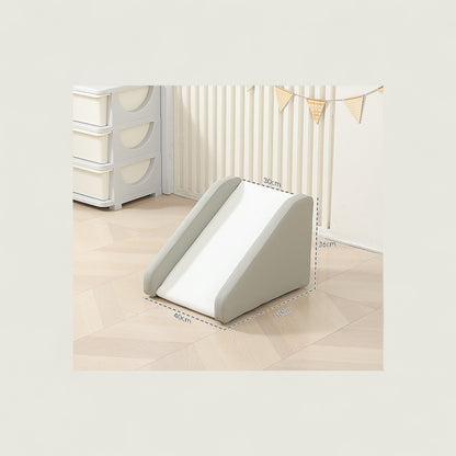Baby wedge cushion on a light wooden floor with a crib and dresser in the background.