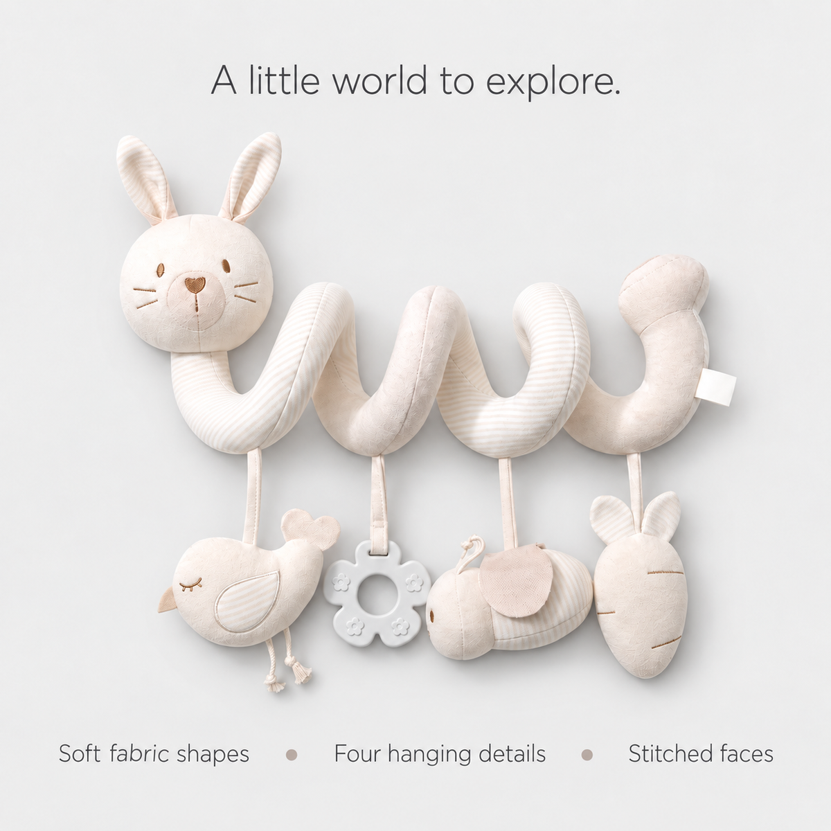 Rabbit spiral toy — soft fabric shapes, four hanging details and stitched faces