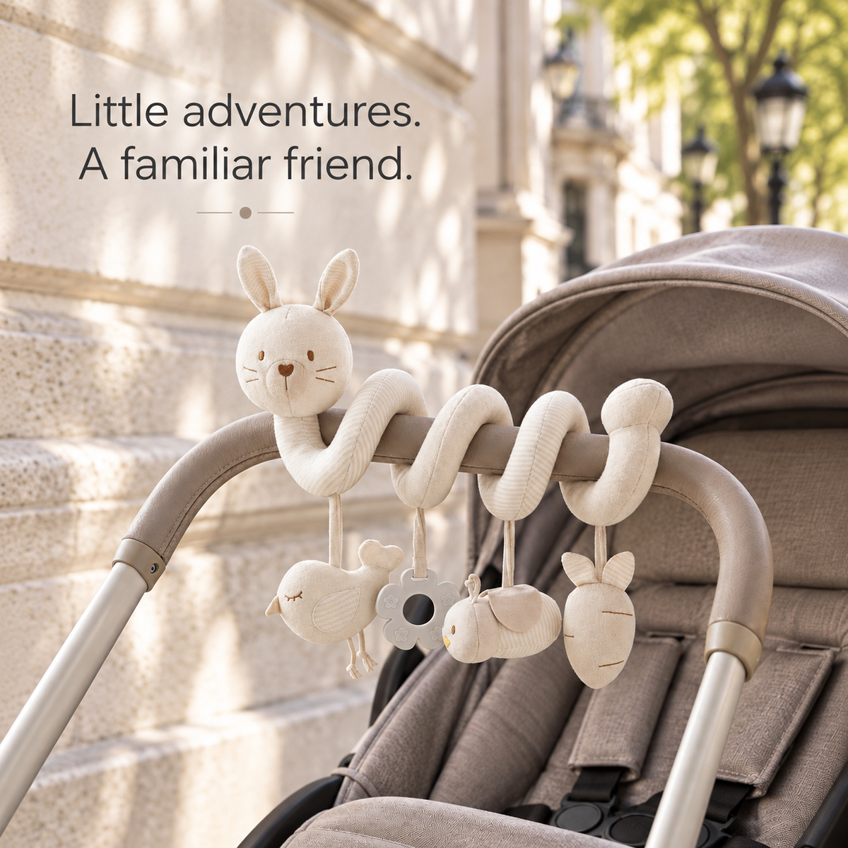 Rabbit spiral toy on a stroller — Little adventures. A familiar friend.