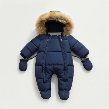 Blue baby snowsuit with fur hood on a light gray background