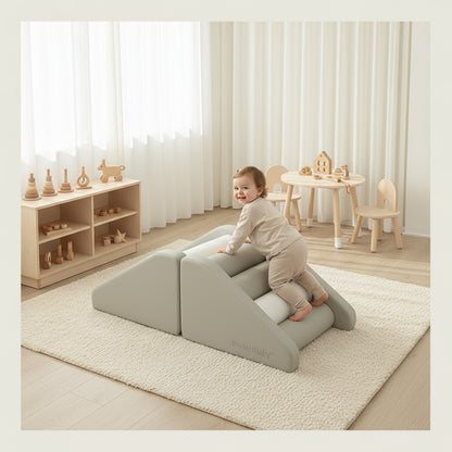 Child playing on a foam wedge in a room with wooden toys and furniture.