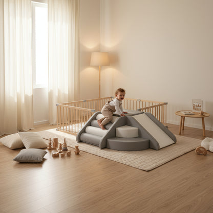 Child playing on a modern play structure in a bright, minimalistic room.