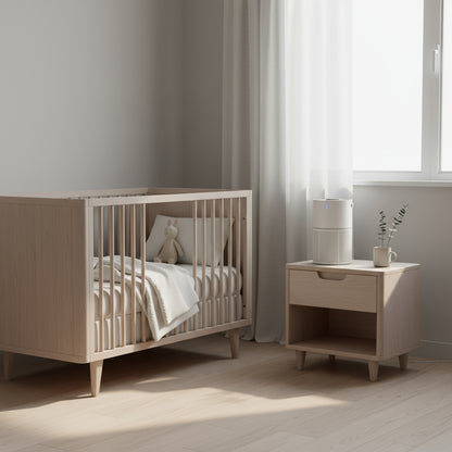 Nursery room with wooden crib and side table near a window.