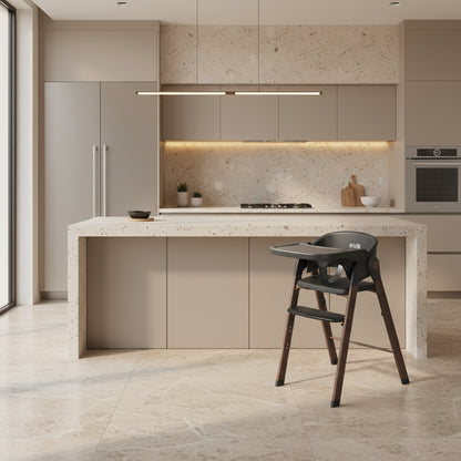 Modern kitchen with a high chair in the foreground