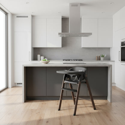 Modern kitchen with gray high chair in the foreground