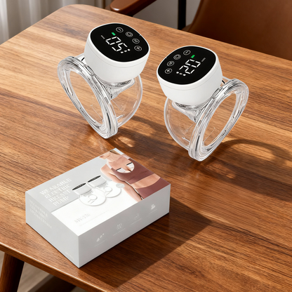 Two digital temperature controllers on a wooden table with their packaging.