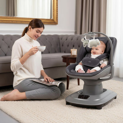 Woman sitting on the floor with a baby in a gray baby seat, reading a magazine.