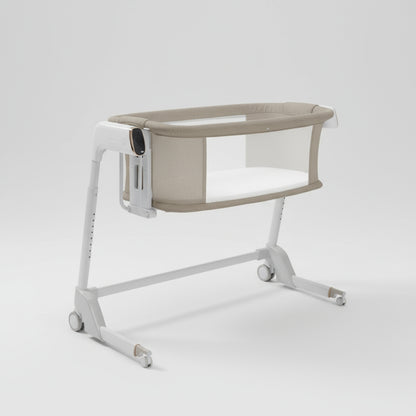 Portable baby crib with beige cover on a white background