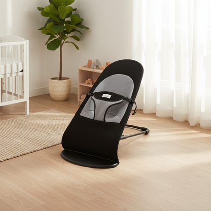 Black baby bouncer in a room with a crib, plant, and shelves.