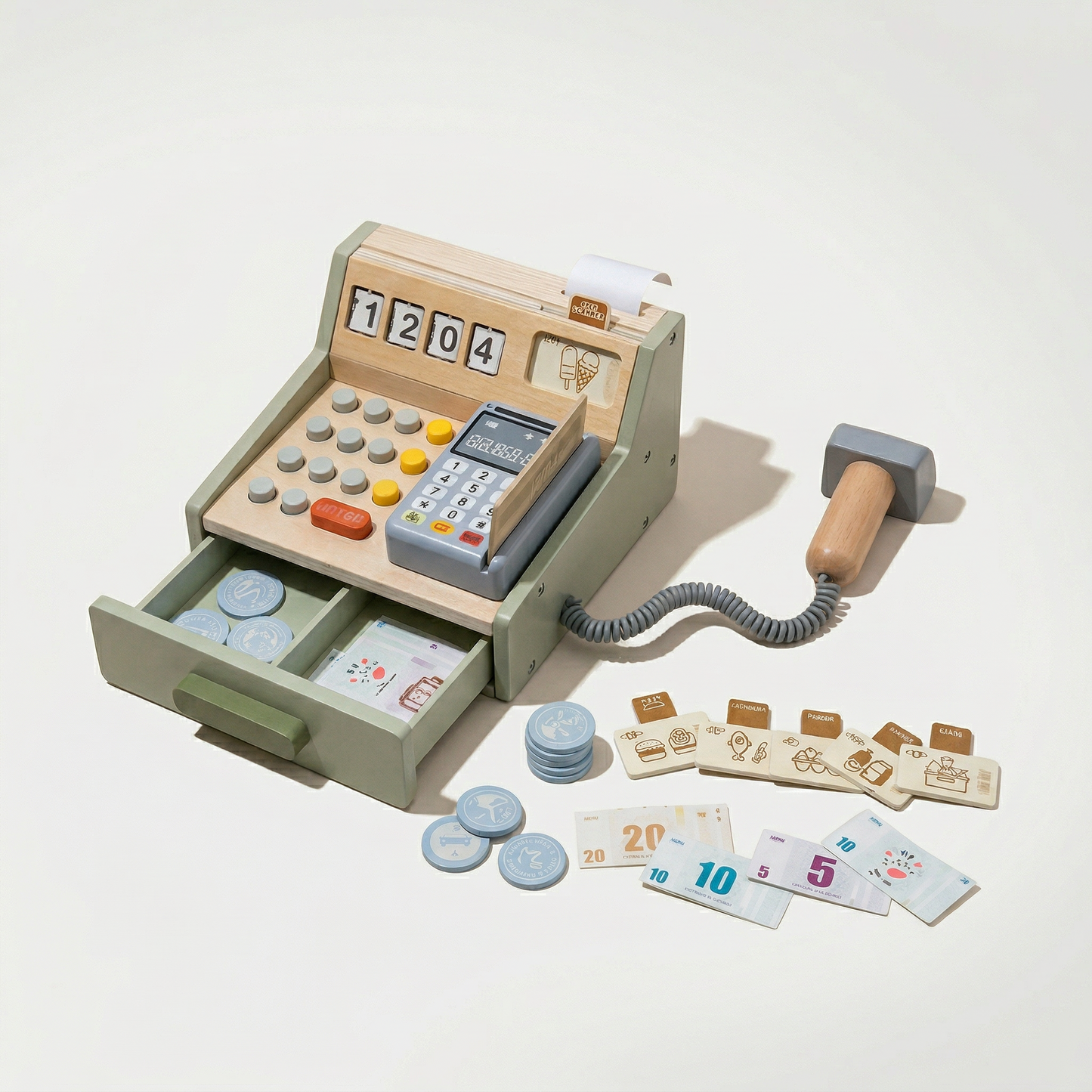 Toy cash register with various accessories on a light background